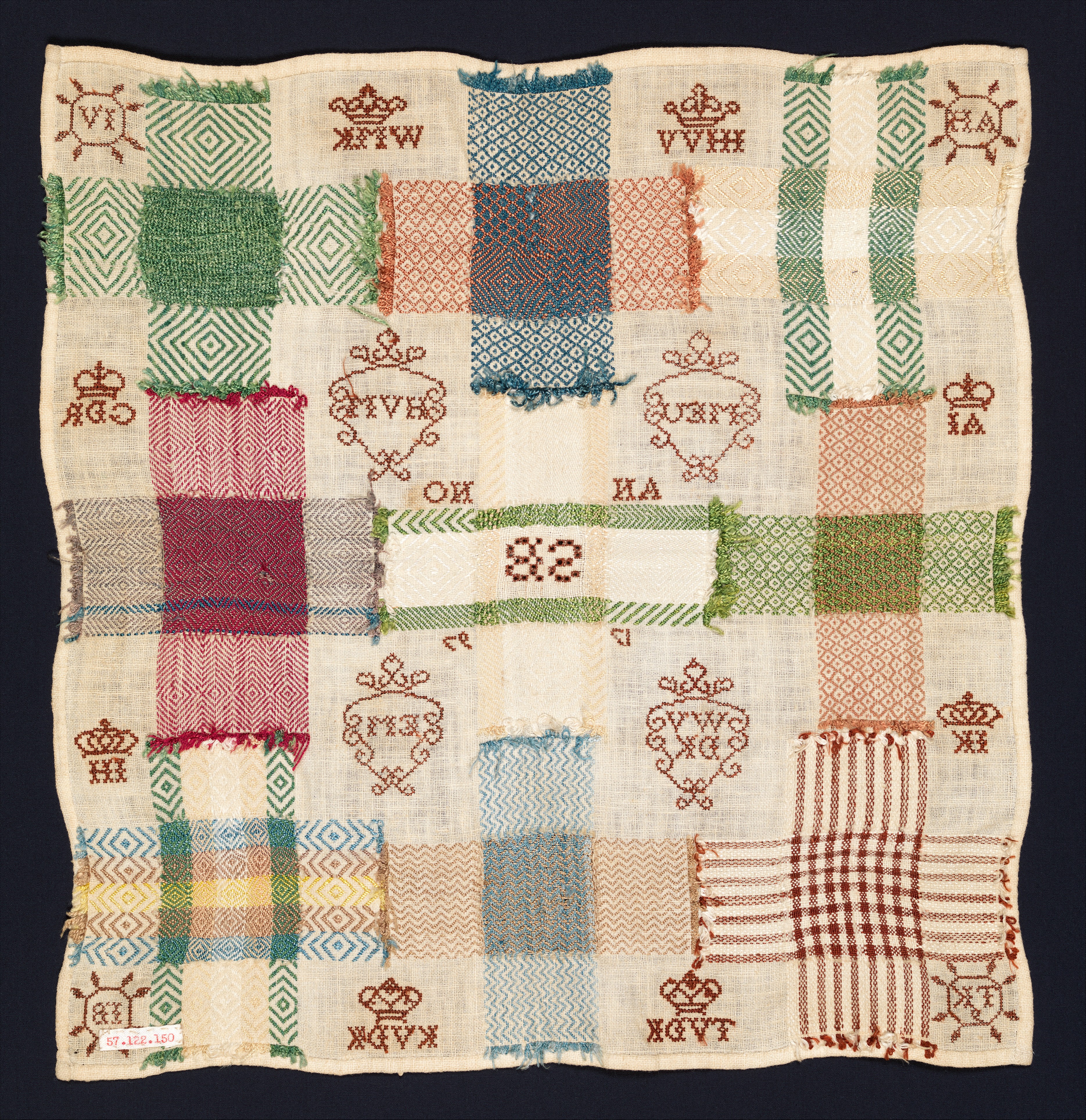 Cream cotton sampler filled with multicoloured cross-shaped darning patterns, geometric stitches, crowns and initials.